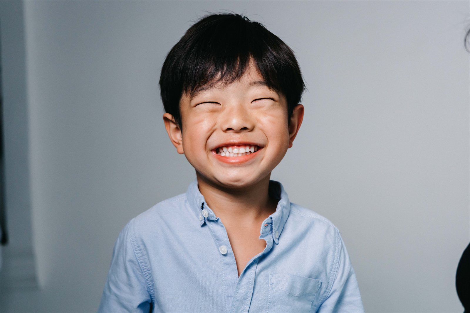Criança sorrindo — odontopediatria (dentista infantil) em Moema